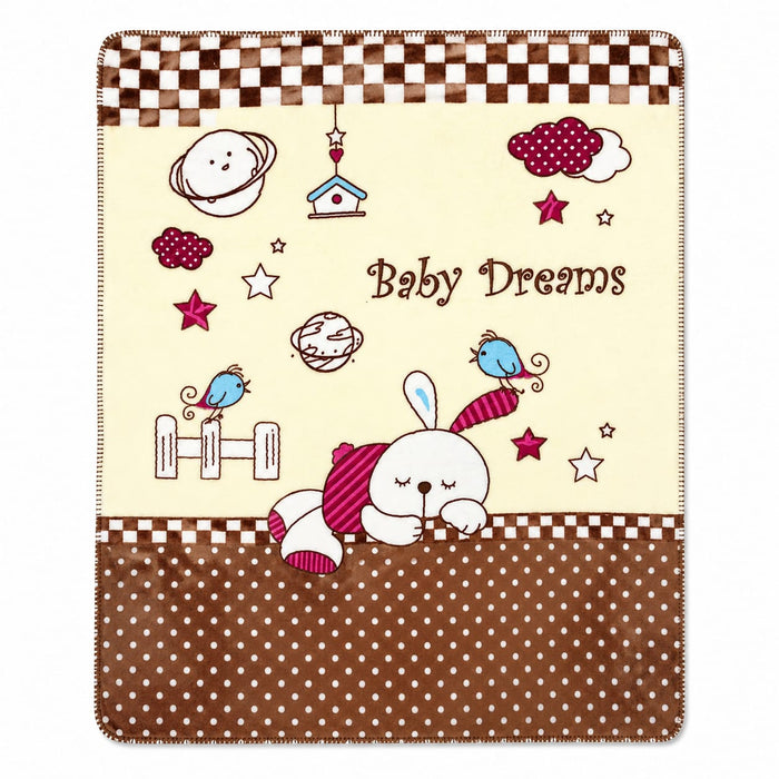 A baby blanket featuring a cute cartoon design with the text 'Baby Dreams'. The blanket has a cream center with illustrations of a sleeping bunny, stars, planets, birds, and clouds, bordered by brown and white checkered stripes at the top and a brown polk