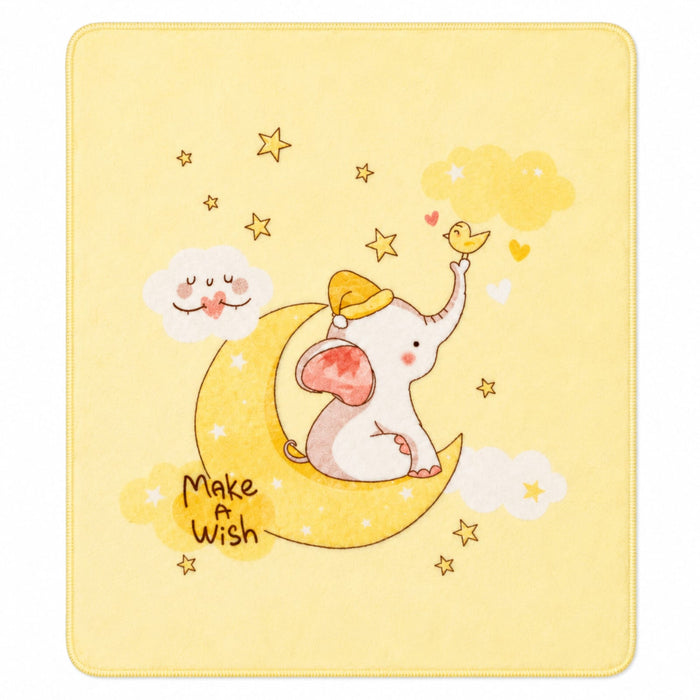 A square baby blanket with rounded corners, featuring a cute illustration of a white elephant wearing a yellow hat, sitting on a yellow crescent moon and reaching toward a small yellow bird. The background is a soft pastel yellow with scattered gold stars