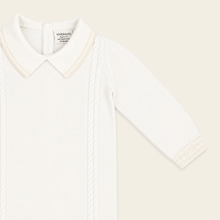 close up front view of milan dove white cable knit baby jumpsuit made of organic cotton