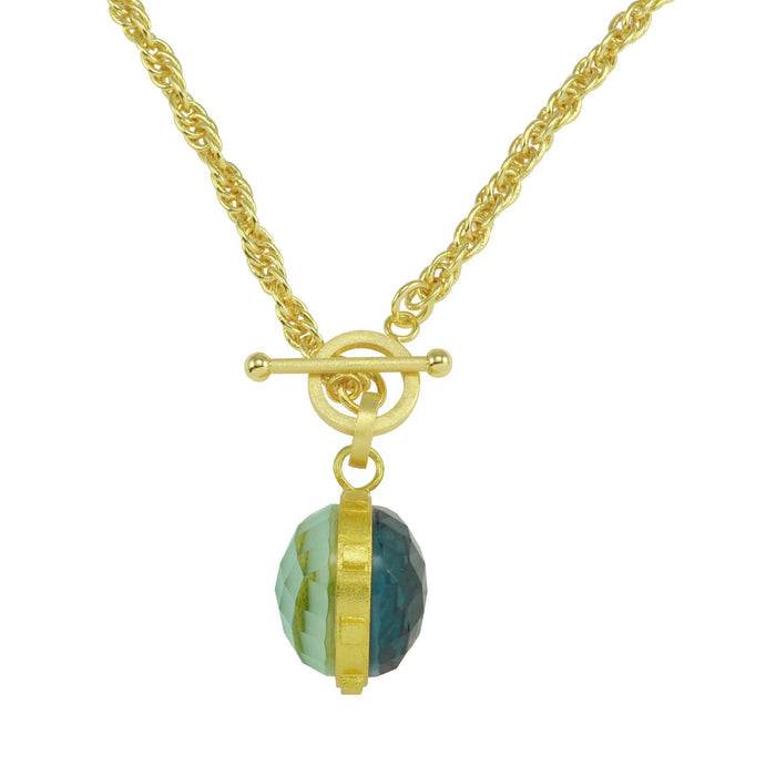 Gold necklace with a green and gold bead on a white background