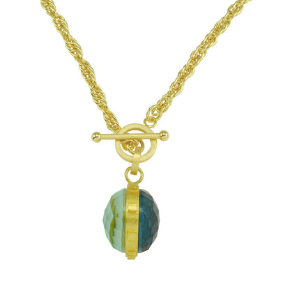 Gold necklace with a green and gold bead on a white background