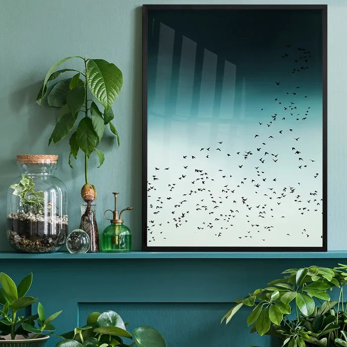 Black-framed "Birds In Flight" Scandinavian style print with a flock of black birds against a teal to light green gradient.