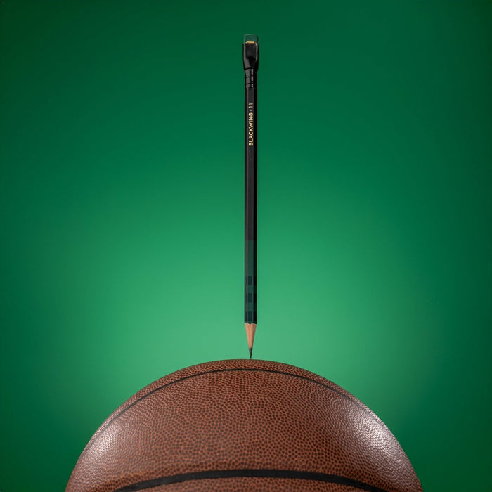 Blackwing Volume 11 Bill Russell Pencil on top of a basketball
