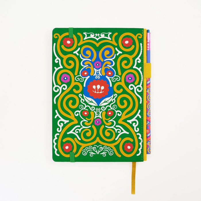 Back of a hardcover notebook with a vibrant green cover decorated with a colorful, symmetrical mandala-style illustration. The notebook features a matching pencil in the side pencil holster, set against a plain white background.