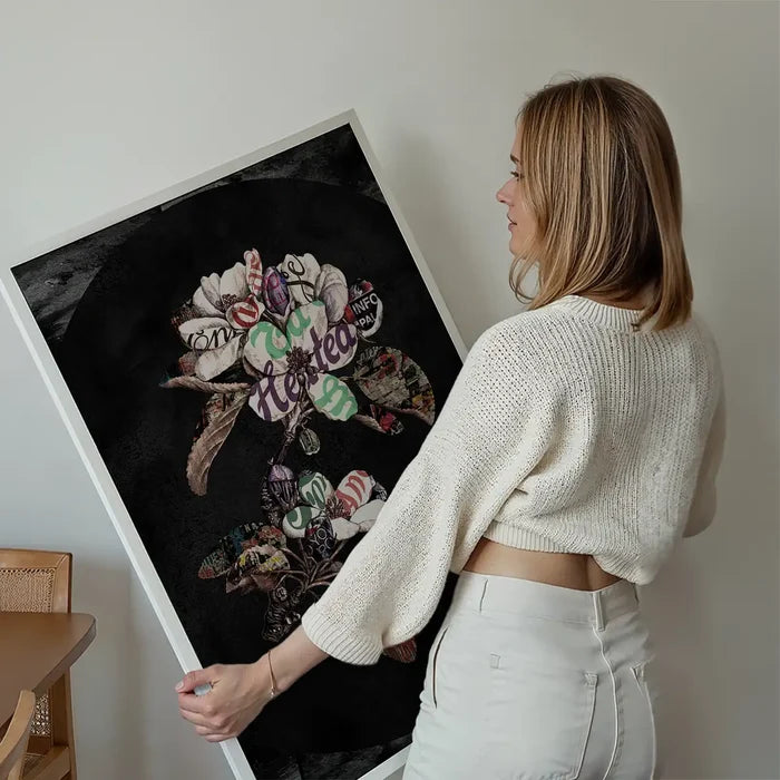 Woman holding a large Botanical 7 Floral Black Typography Print with colorful petals and vintage text.