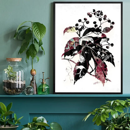 Framed botanical leaves print with black, red, and white graffiti-style details on a white background.