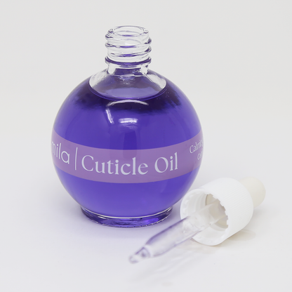 Lavender & Chamomile purple cuticle oil round bottle with the dropper cap beside it