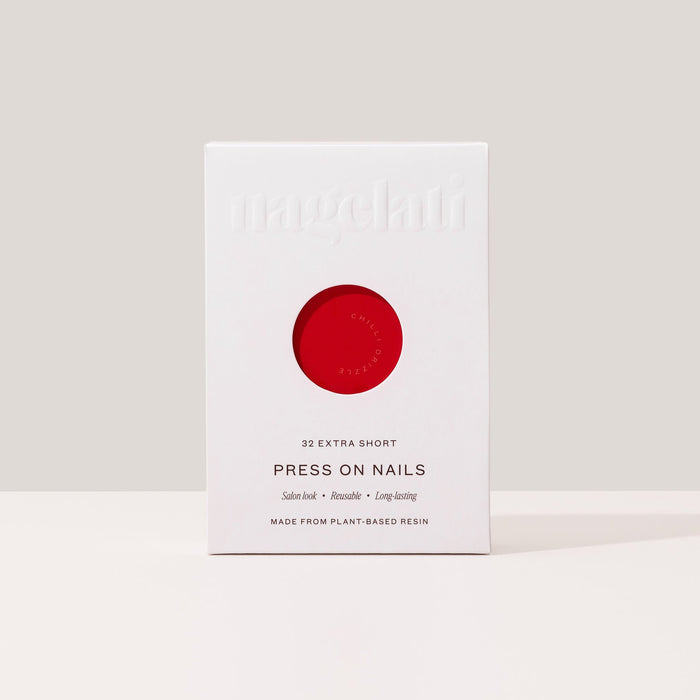 Press-on nails in plastic-free packaging made from FSC-certified paperboard.