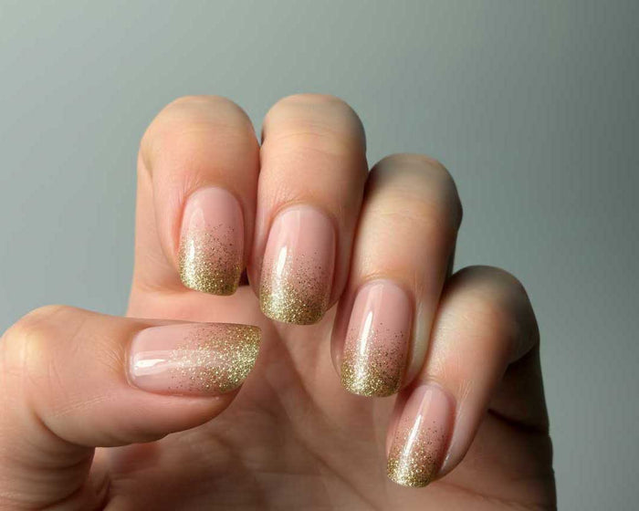 Pink Champagne UV-Free gel nail wraps worn on the hand, included in The Bold Edit gift set