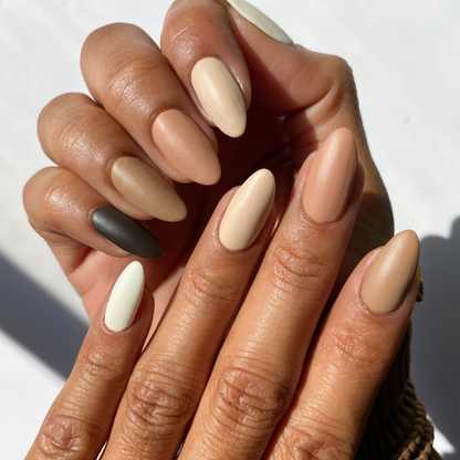 Cocoa Kisses taupe, brown and cream mix-and-match manicure on a medium skin tone