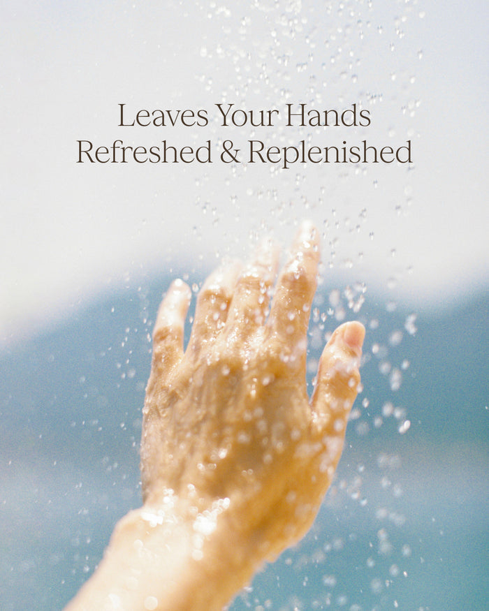 Hand under water with text 'Leaves Your Hands Refreshed & Replenished'