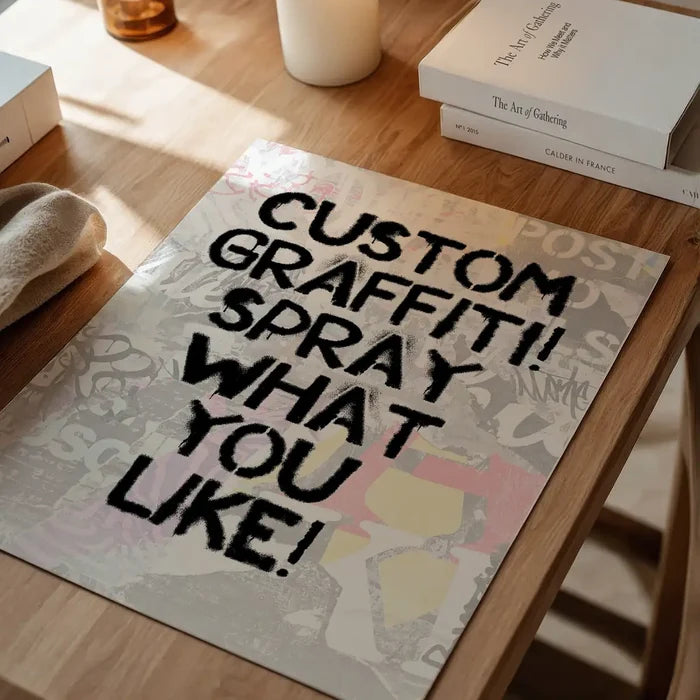 Custom graffiti stencil print with "CUSTOM GRAFFITI! SPRAY WHAT YOU LIKE!" in black spray paint on a light background.