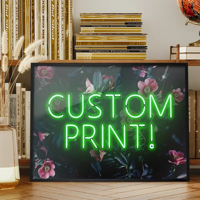 Custom green neon sign print on a dark floral background, framed, displayed on a wooden surface.