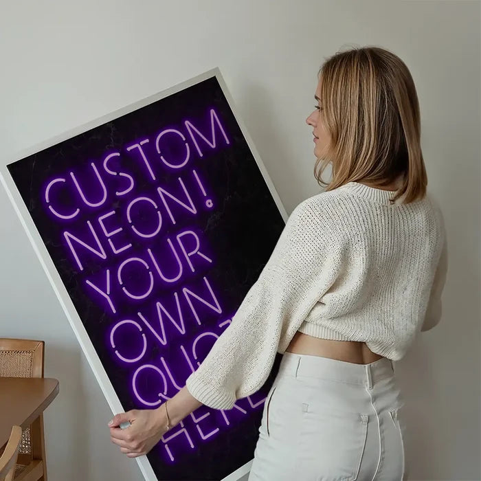 Woman holding a custom purple neon sign print with "CUSTOM NEON! YOUR OWN QUOTE HERE" text.