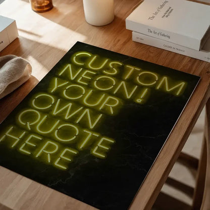 Yellow custom neon sign print on a dark background, displayed on a wooden table.