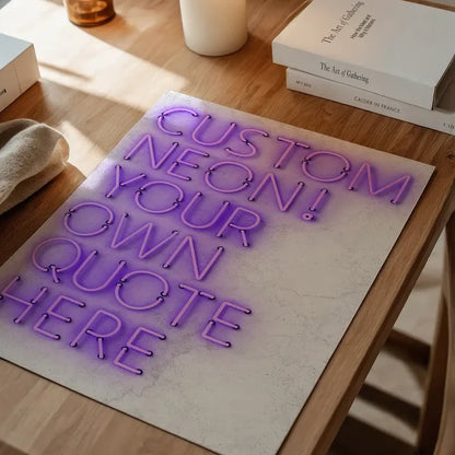 Purple custom neon quote print on a textured white background, displayed on a wooden table.