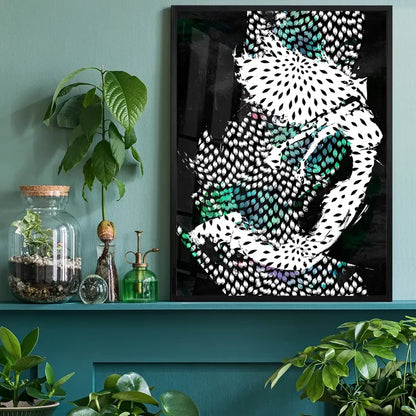 Abstract Dancer 1 art print with fragmented patterns in black, white, and teal, framed on a green shelf.