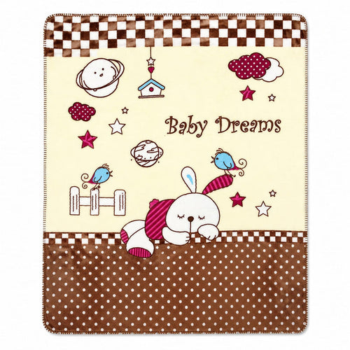 A baby blanket featuring a cute cartoon design with the text 'Baby Dreams'. The blanket has a cream center with illustrations of a sleeping bunny, stars, planets, birds, and clouds, bordered by brown and white checkered stripes at the top and a brown polk