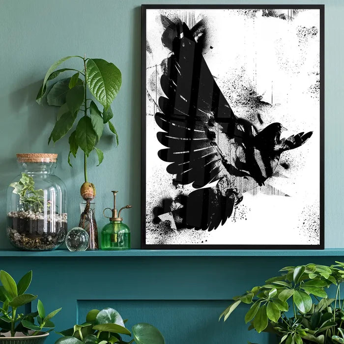 Black and white abstract Dove graffiti print in a black frame, displayed on a teal shelf.
