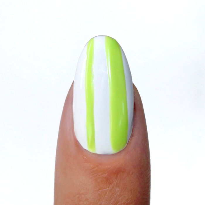 Electric Lime liner used for lime green vertical stripes on a sheer nude nail