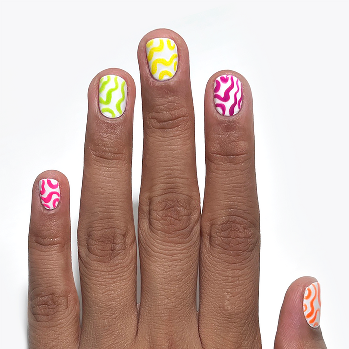 Electric Lime and neon liners used for squiggle nail art on a medium skin tone