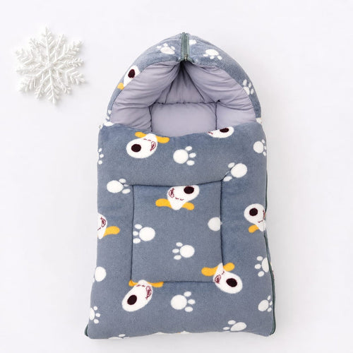 A gray pet fleece bootie with a cartoon dog and paw print pattern, shown on a white background with a decorative white snowflake in the corner.