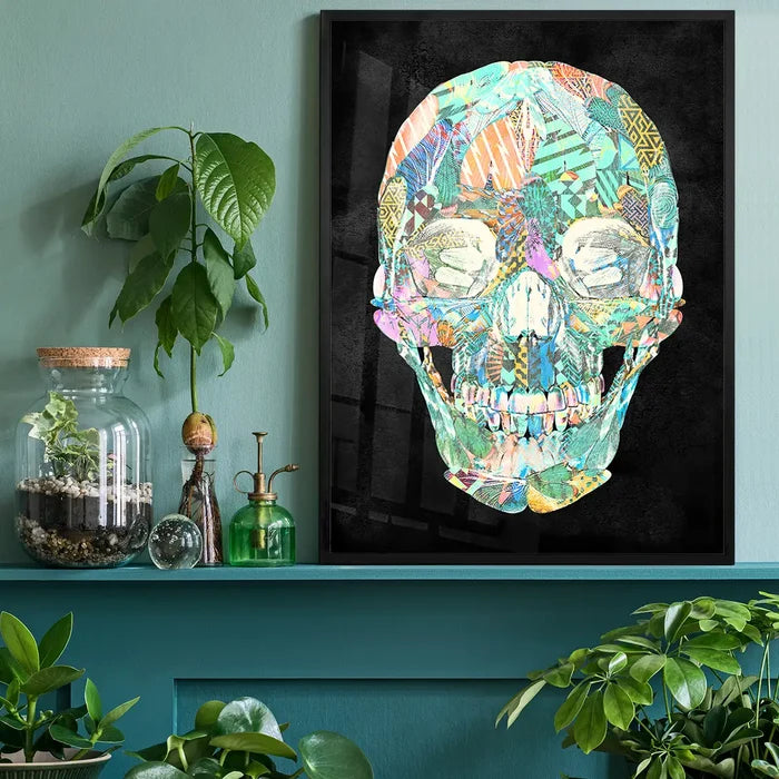 Geometric pastel pattern skull print on black background, framed, displayed on a teal shelf.