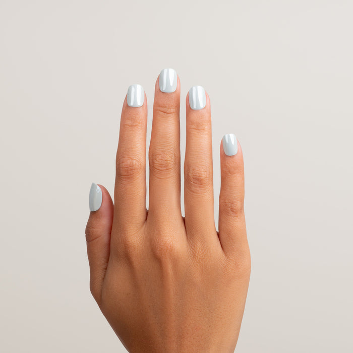 Hand with light blue nail polish