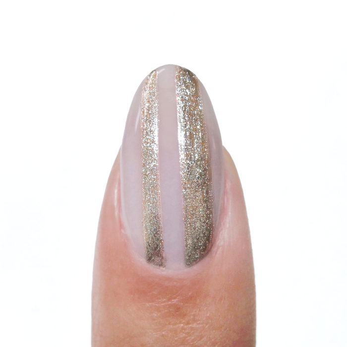 Gladiator Bronze liner used for a metallic bronze vertical stripe on a sheer nude nail