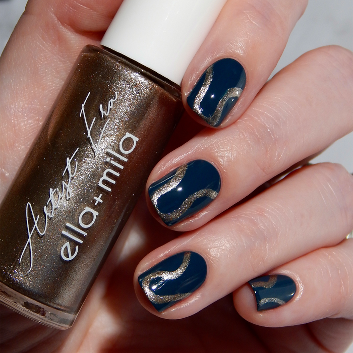 Gladiator Bronze liner used for bronze abstract swoosh nail art on a navy manicure, holding the bottle