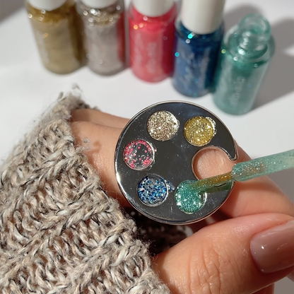 Glitter Era liners on a palette ring with glitter dot nail art and a knit sweater