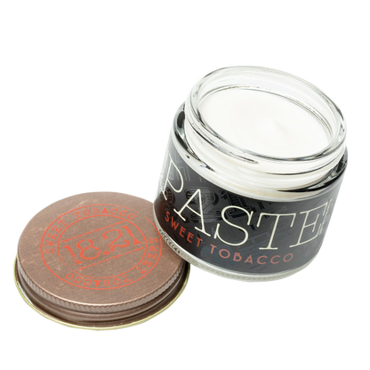 Jar of 'PASTE' sweet tobacco with a brown lid on a white background