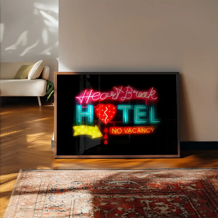 Retro Heartbreak Hotel neon sign art print with a glowing red broken heart, teal lettering, and yellow arrow on black.