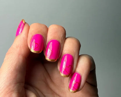 Heartbreaker nail art bundle look, bright pink nails with gold heart accents