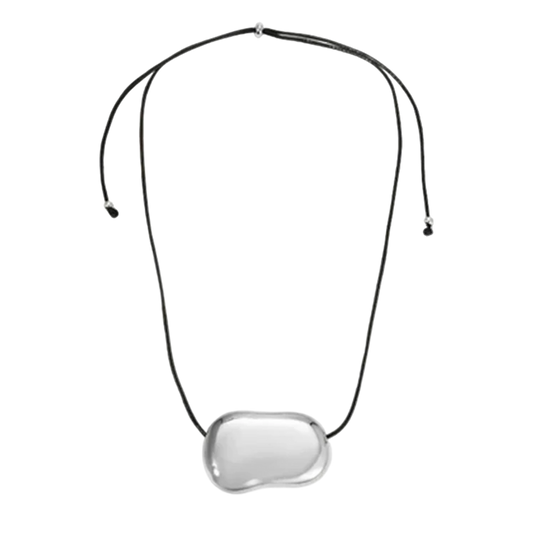 Necklace with a clear pendant on a white background