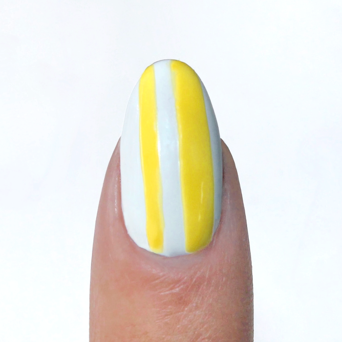 Highlighter Yellow liner used for neon yellow vertical stripes on a sheer nude nail