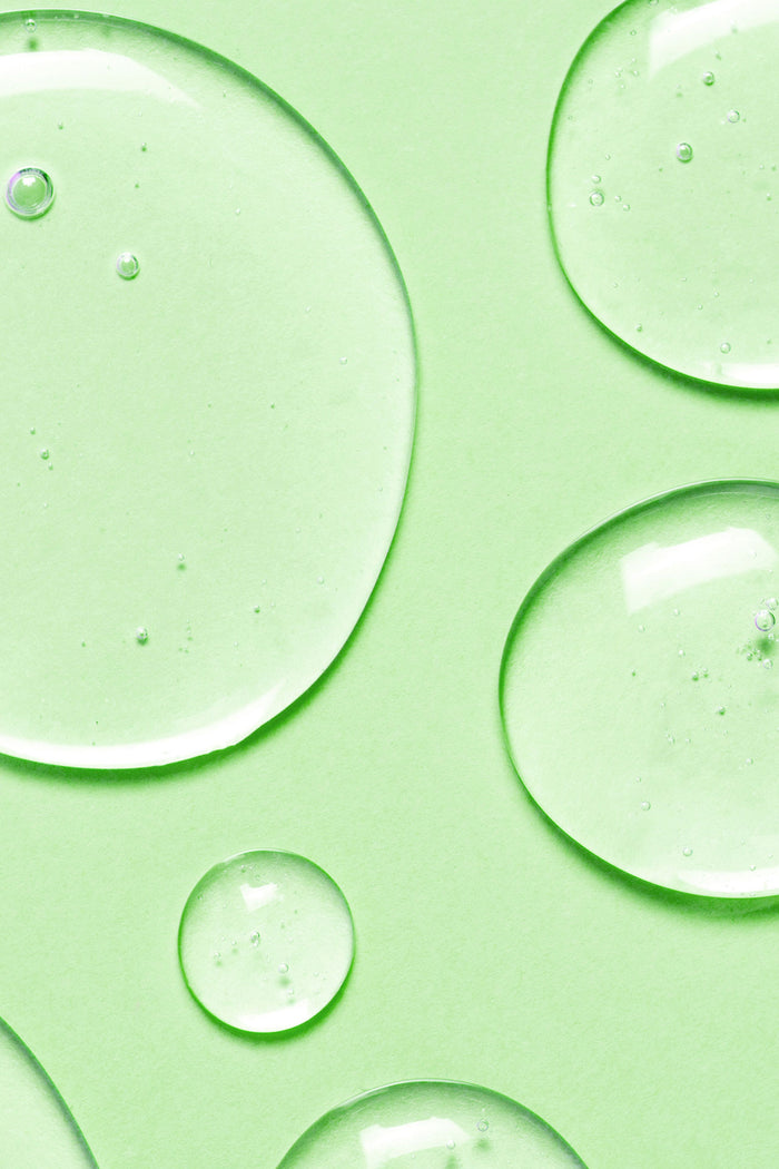 fresh water drops on a light green background