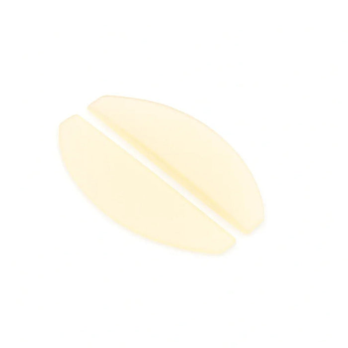 light yellow flat korean lash lifting shields on a white background