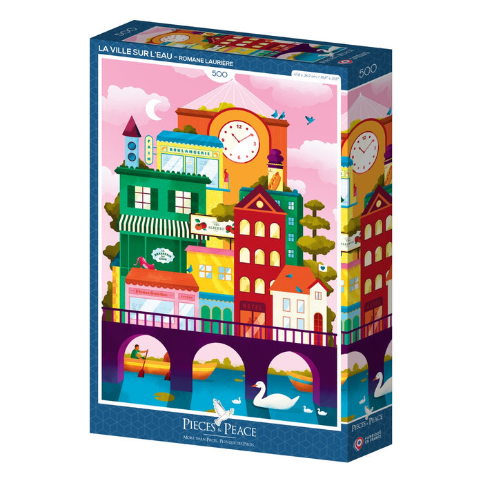 The Pieces & Peace La Ville Sur L'eau 500-piece jigsaw puzzle features a colorful cityscape over a river with swans. Illustrated by Romane LaPierre and made in France, it’s a unique addition to any puzzle collection.