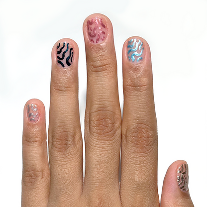 Metallic Muse and metallic liners used for abstract accent nail art on a medium skin tone