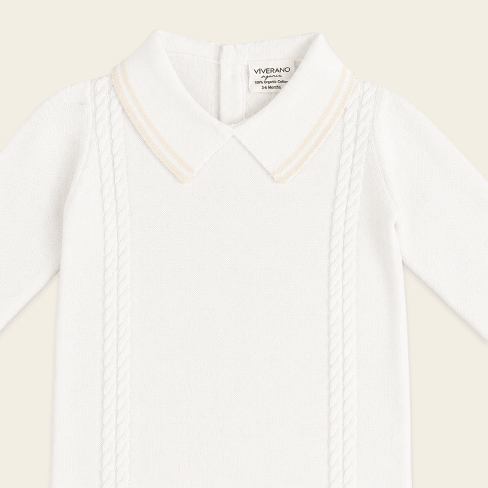 close up view of milan dove white cable knit baby jumpsuit made of organic cotton