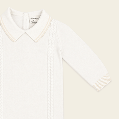 close up front view of milan dove white cable knit baby jumpsuit made of organic cotton