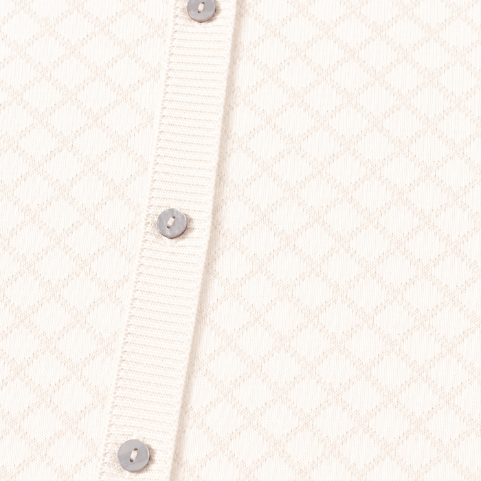 Close up of buttons and pattern on Milan Dove White Lux Jacquard Knit Baby Jumpsuit andHat and Bootie 3pc SET Organic cotton
