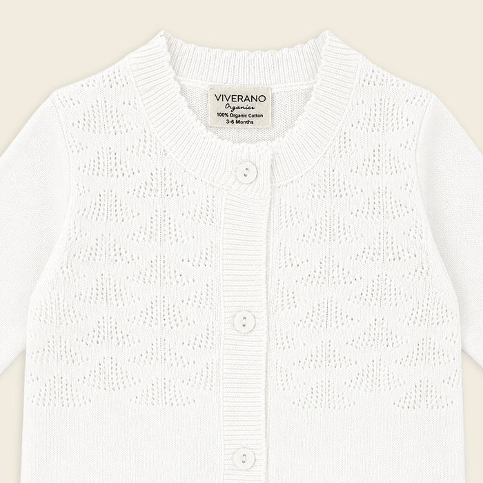 detail of milan dove white delicate pointelle knit baby jumpsuit made with organic cotton