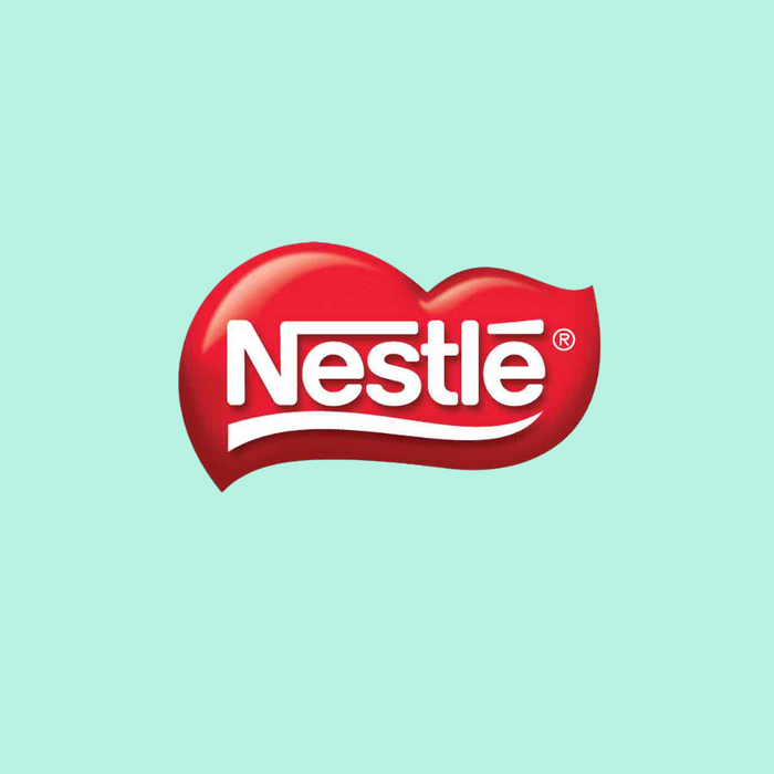 White Nestle logo in a red heart-shaped bubble on a light blue background.