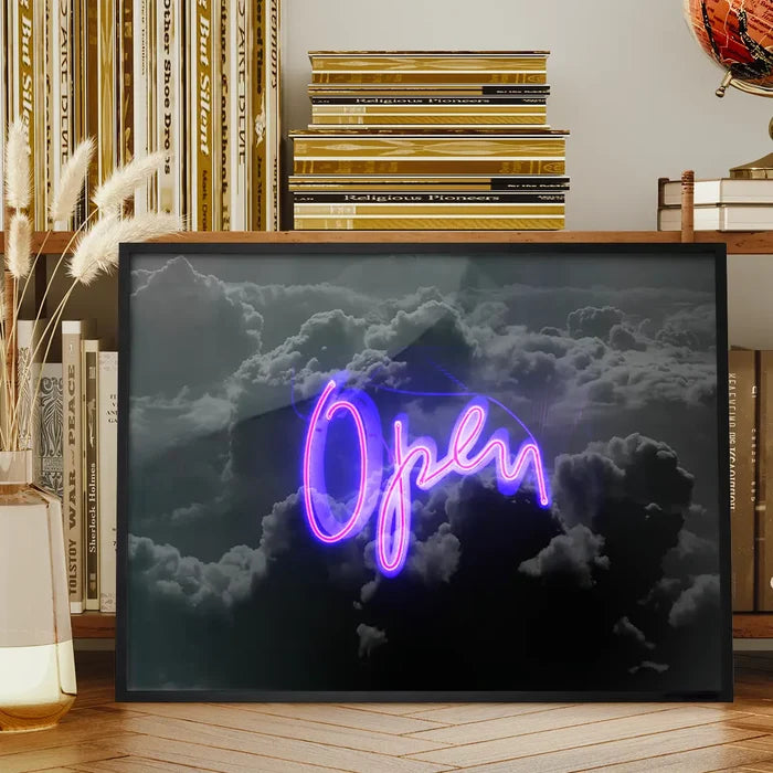 Framed art print featuring a glowing purple neon script word OPEN against a moody, dark grey cloud background.