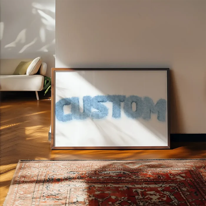 Framed pastel blue fur-style "CUSTOM" name print on a white background, leaning against a wall.