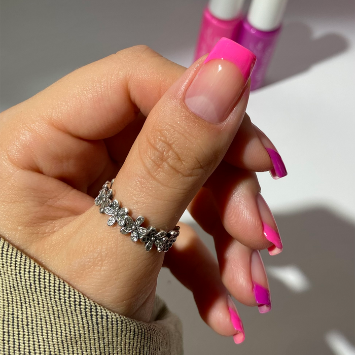 Pink Punch liner used for thin neon pink French tips on a light skin tone with a ring