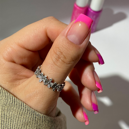 Pink Punch liner used for thin neon pink French tips on a light skin tone with a ring