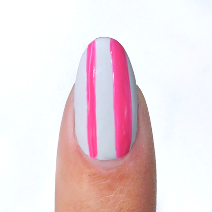 Pink Punch liner used for neon pink vertical stripes on a sheer nude nail